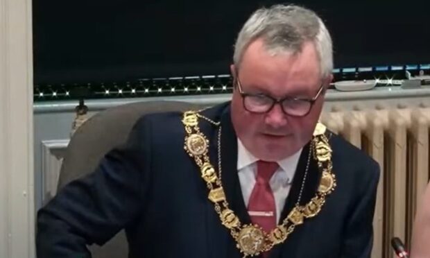 Newly-appointed Angus Provost Craig Fotheringham during the council clash. Image: Angus Council/You Tube