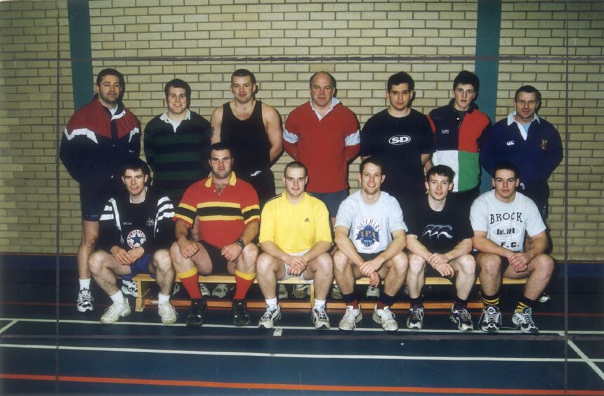 Perthshire Rugby Club pose for a picture in a gym hall at Bell's Sports Centre.