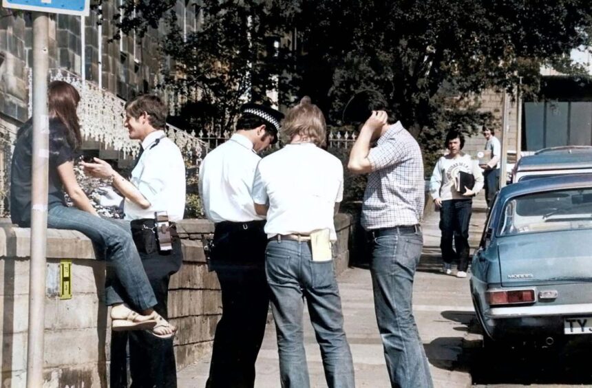 Police in the street speaking to witnesses after the Roseangle murders in Dundee in May 1980