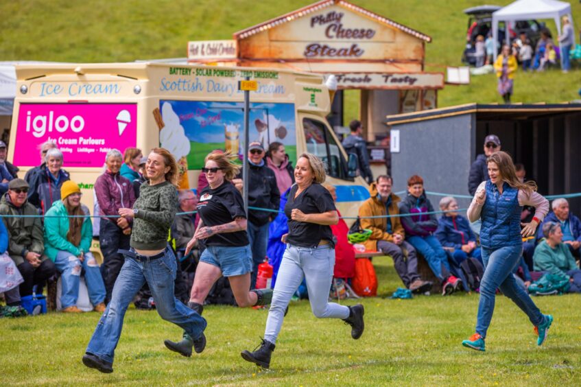 Women running in jeans and t shiirts