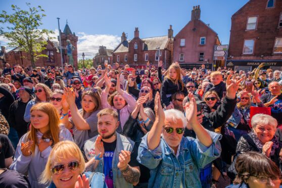 Thousands packed Kirrie Town Square beside the Peter Pan statue for Long Way to the Top. Image: Steve MacDougall/DC Thomson