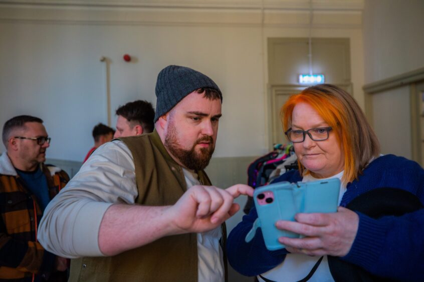 Thomson-Leng Musical Society president Donna Bell speaks with actor Sean O'Rourke.