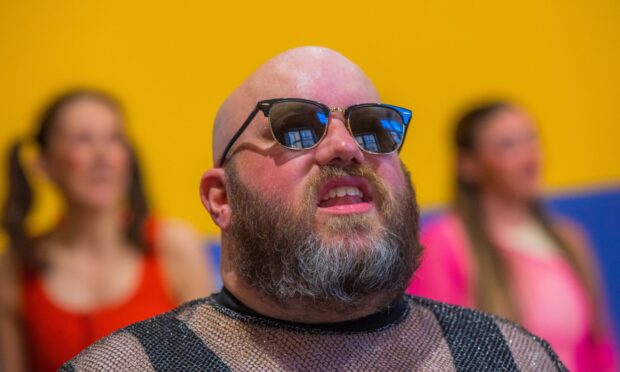 Paul Creegan wearing sunglasses in Thomson-Leng Musical Society Rent rehearsal