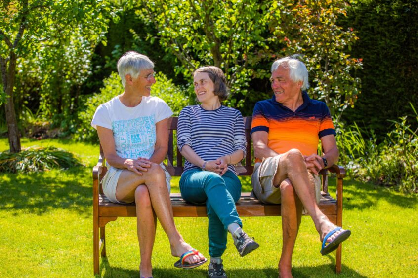 Ruth with her parents Julia and Malcolm. 