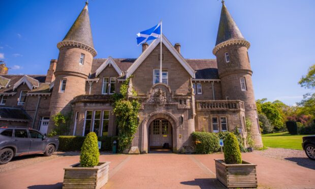 Ballathie House Hotel frontage with Scottish flag