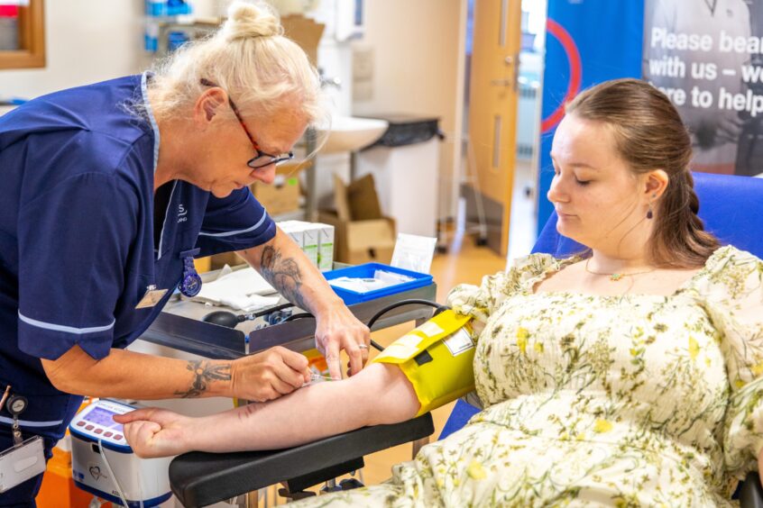 Senior charge nurse Cat Durning looks after social work student Sarah Jones, 20, from Dundee, as she donates at Dundee Blood Donor Centre in Ninewells Hospital.