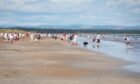 Chariots Beach Race competitors relax on West Sands beach in 2024