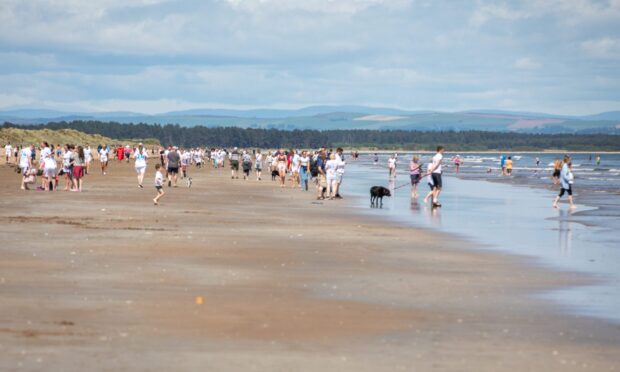 Chariots Beach Race competitors relax on West Sands beach in 2024