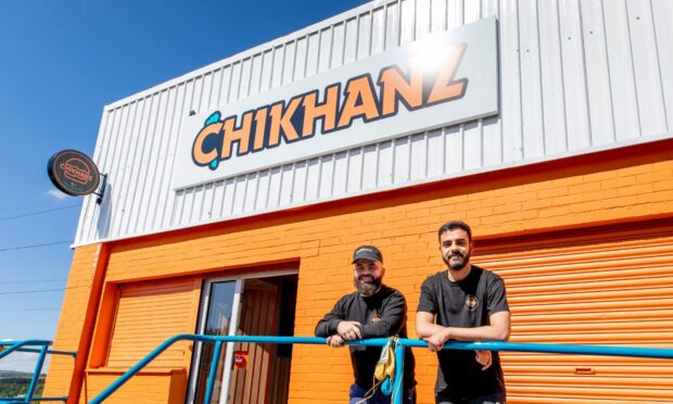 Owner Ali Khan (left) with staff member Faisal outside Chikhanz.