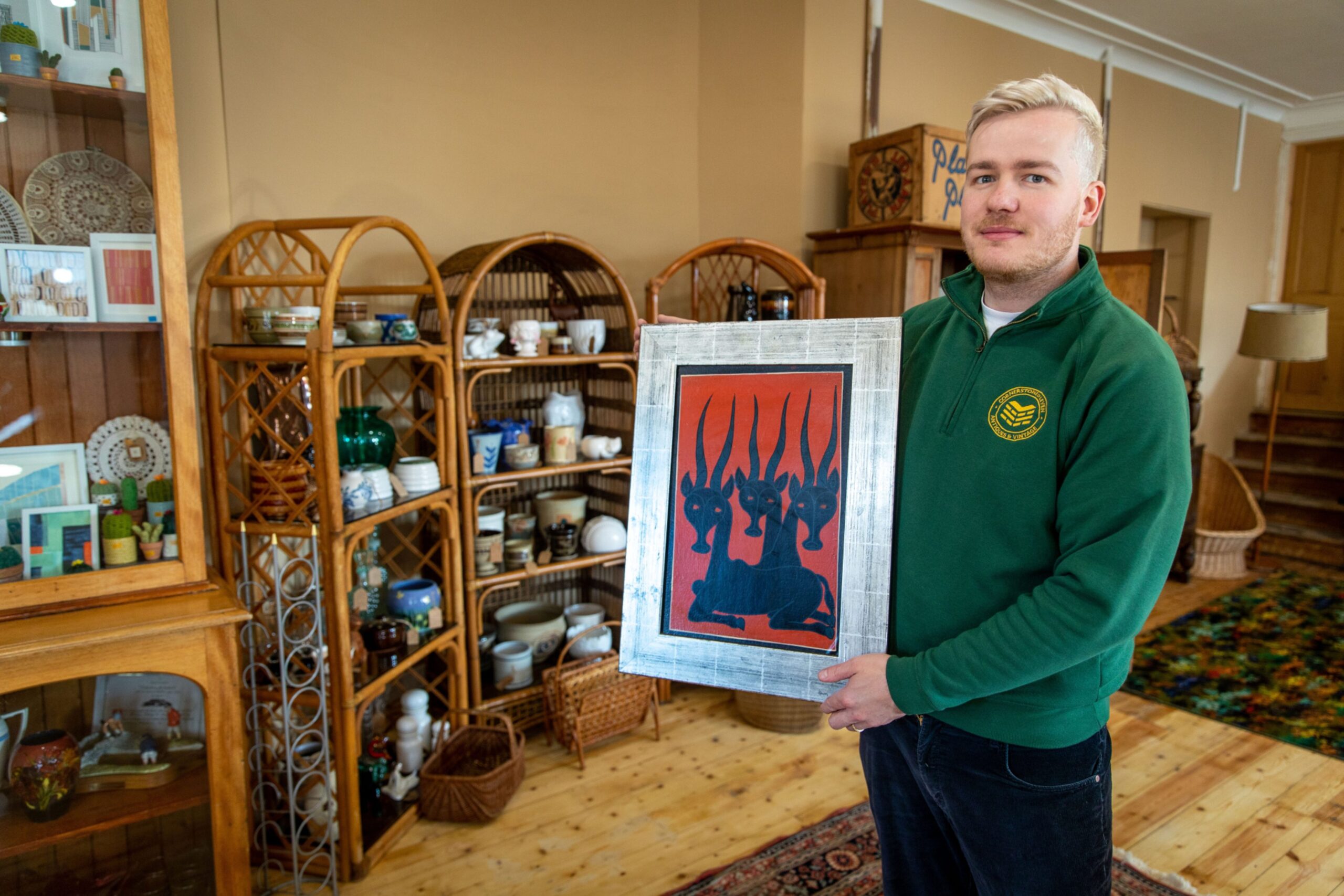 Douglas with one of the art pieces for sale.
