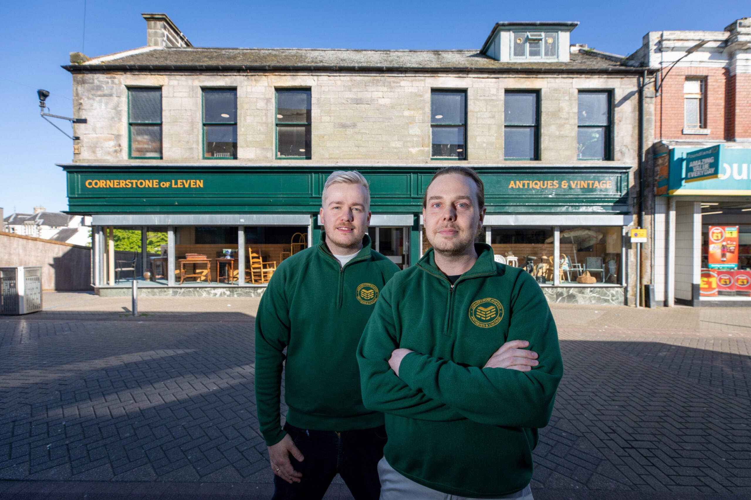 Douglas and Brett outside the shop.