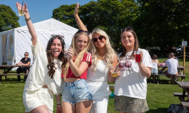 Kinross girls Erin Winton, Lauren Graham, Erin Sharp and Isla Prentice lapping up the sunshine  at Kinross Beer Garden and Funfair today. Image: Steve Brown/DC Thomson