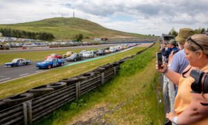 Racing fans enjoy the parade of 70's & Classic Cars during the 50th anniversary celebrations. Image: Steve Brown/DC Thomson