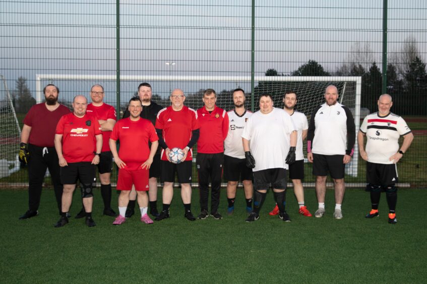 Paul with the other members of MAN V FAT Football Fife.