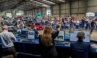 Auctioneers get the bids in for the 1995 Toyota Celica today at the Morris Leslie Classic Car Auction at Errol Airfield. Image: Steve Brown/DC Thomson