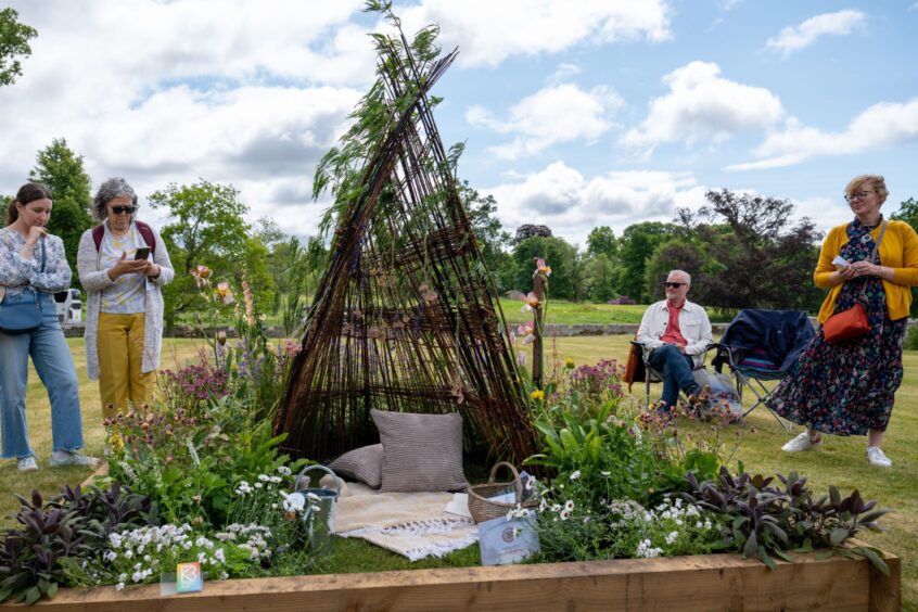 People looking at garden display