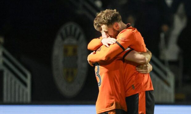 Ross Docherty and Louis Moult, two of the four players to exit, illustrate the togetherness at Tannadice