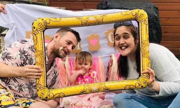 Dundee couple Craig Armstrong and Michele Glen with daughter Holly.