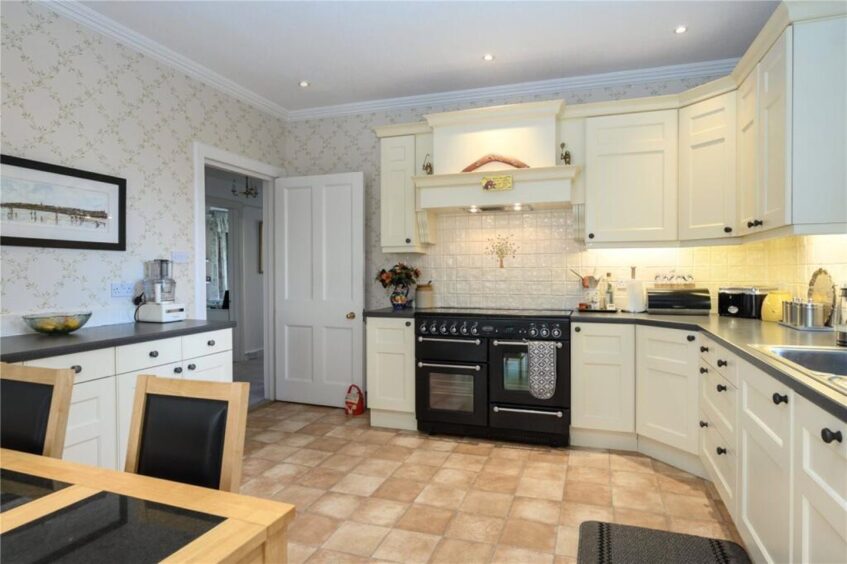 The kitchen features a breakfast area
