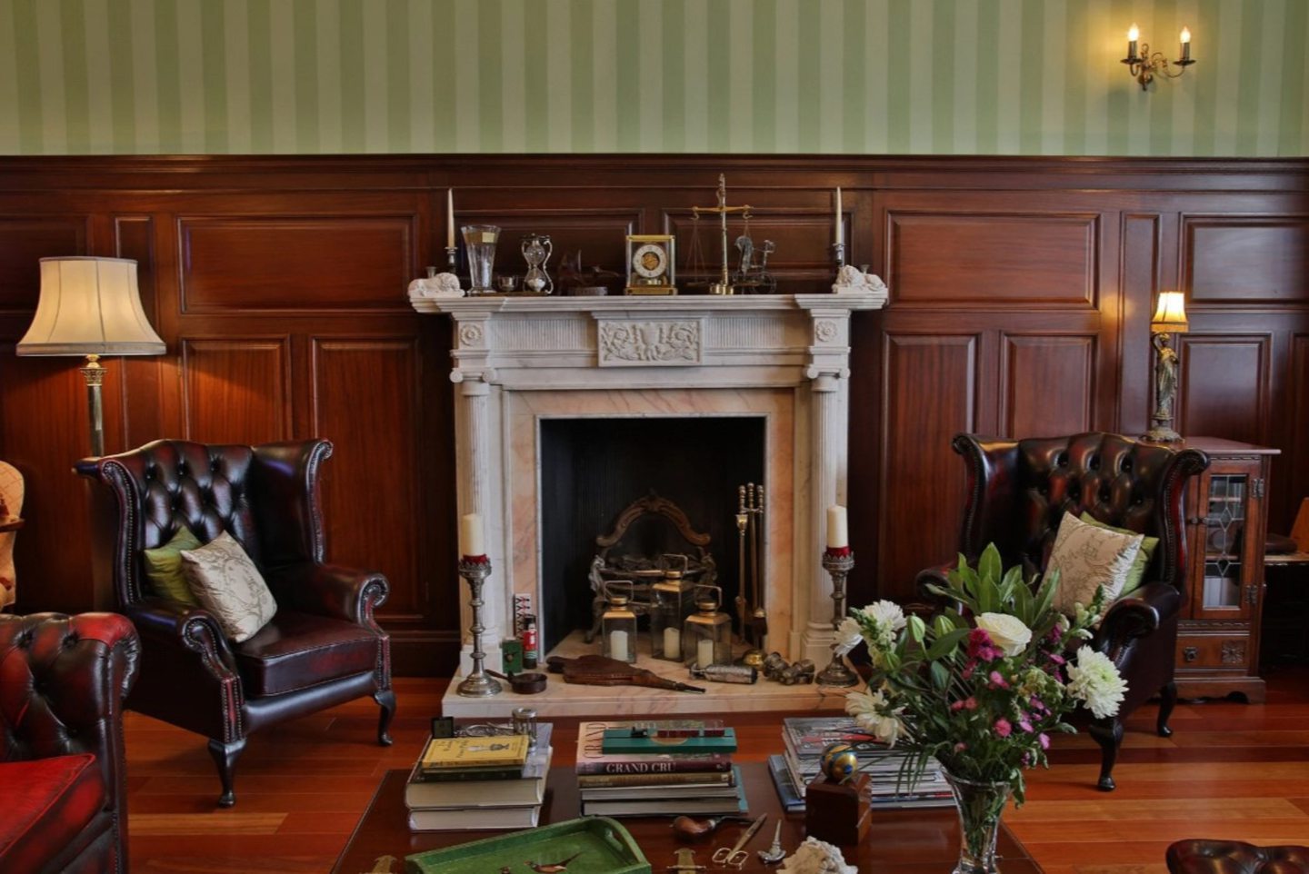 A stone fire place is the the centrepiece of the main living room. 