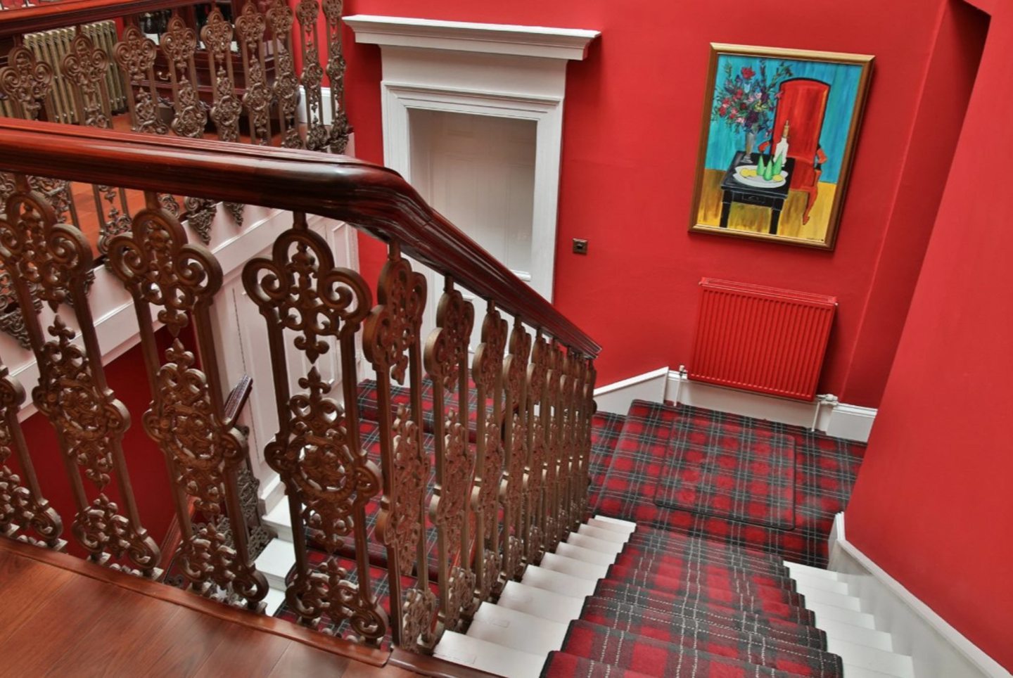 Sweeping double staircase leading to the second floor.