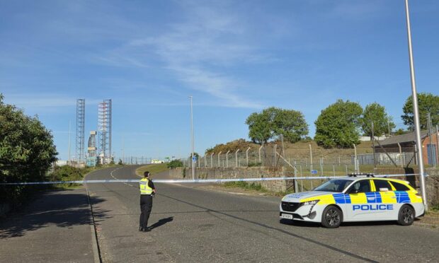 Police have sealed off Stannergate Road in Dundee.