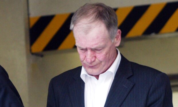Rab Thomson is led from court in Edinburgh.