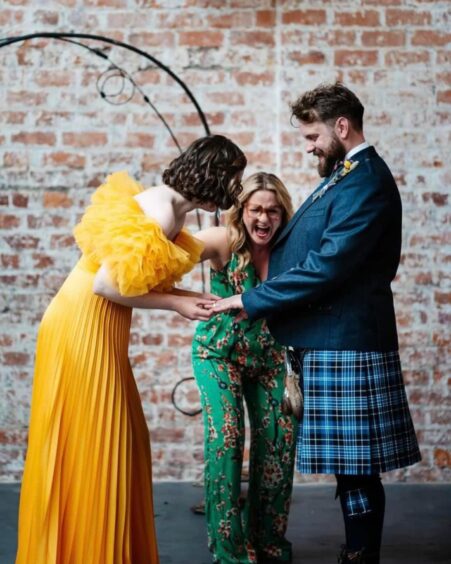  TJ officiating at one of her weddings.