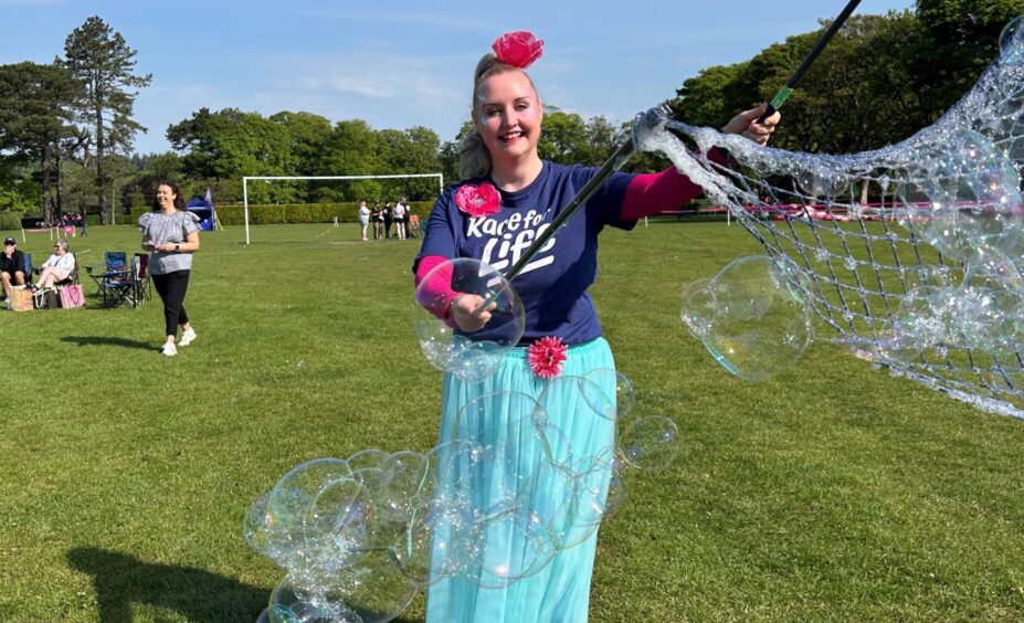 Verity Power entertained with bubbles.