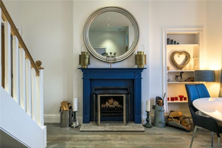 A fireplace in the sitting room.