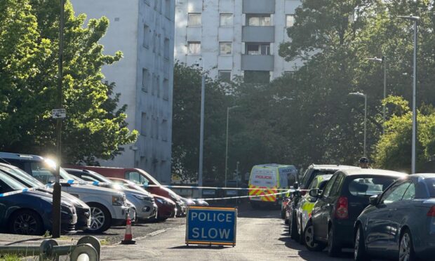 Police have cordoned off Tulloch Court in the Hilltown.