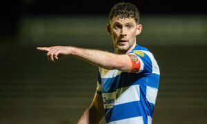 Jack Baird issues an order on the pitch.