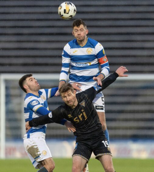Jack Baird wins a header.