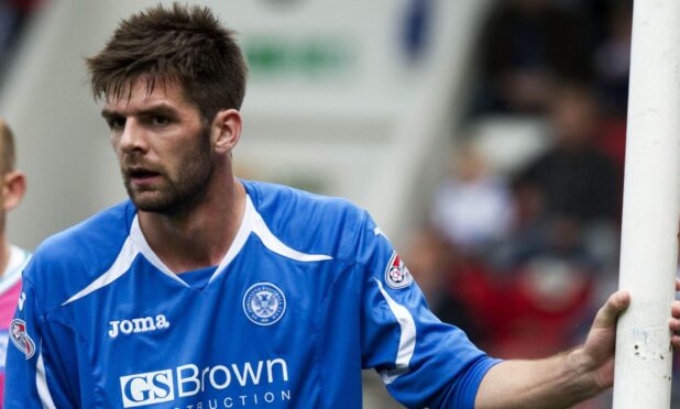 Cillian Sheridan leaning on a post before a corner.