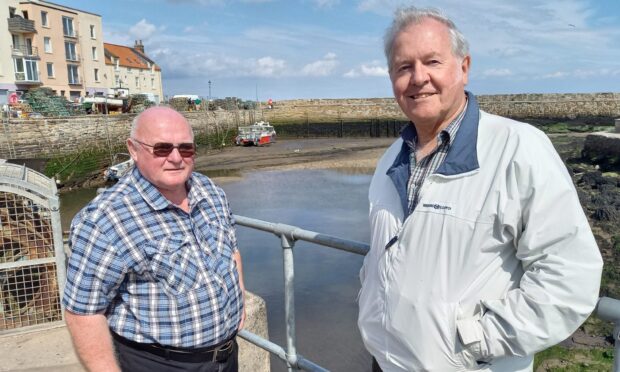 Senior coastal engineer Nick Bean, of Mott MacDonald, explains the options to Roslyn Kennedy