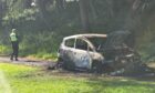 The car has been destroyed by fire. Image: Andrew Robson/DC Thomson