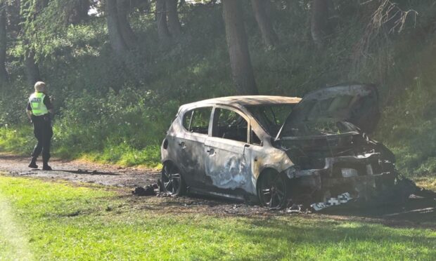 The car has been destroyed by fire. Image: Andrew Robson/DC Thomson