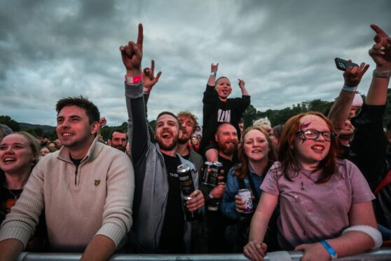 Crows at music festival pumping fists in air
