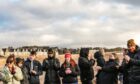 Dr Elinor Harper (centre, red hat) at a Relight baptism service in Brought Ferry, February 2025. Image: Mhairi Edwards/DC Thomson.