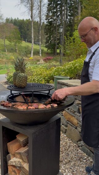 A cooking demonstration during the kids's day out. 