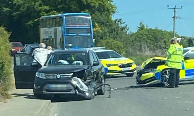 A crash, which involved a police car and another vehicle, happened at the junction of the B921 and B922 in Kinglassie.
