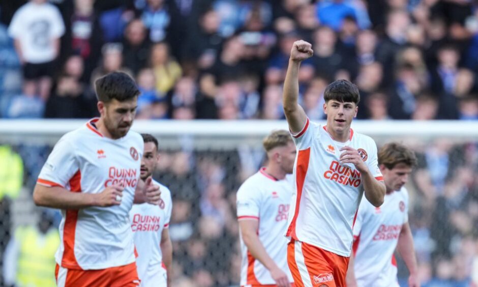 Cleall-Harding pumps his fists towards the United fans