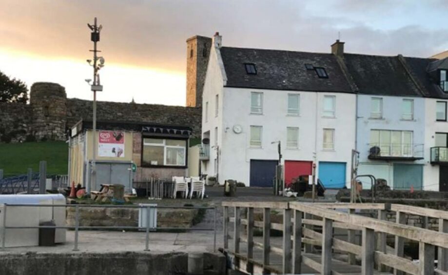 The existing St Andrews Harbour cafe on the left, is a small, te,porary building.