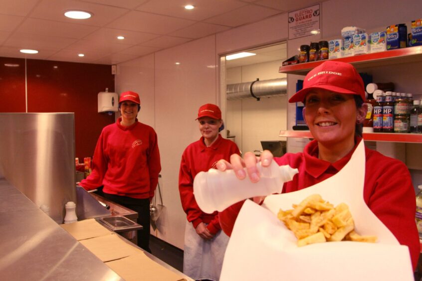 Staff serving up chips at The Bridge in 2010.