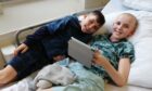 Aaron was supported by his brother Elliot during cancer treatment.
