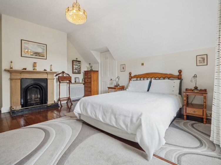 The bedroom in Tigh-na-Traigh has a fireplace.