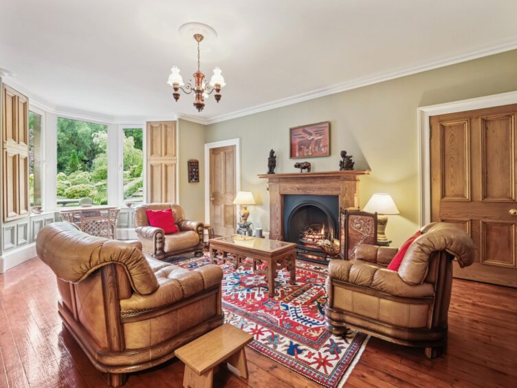 The living room in Tigh-na-Traigh has views of the garden.