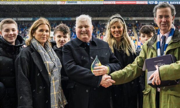 St Johnstone fan Stewart Falconer (centre) was recently crowned Fan of the Year. Image: St Johnstone FC