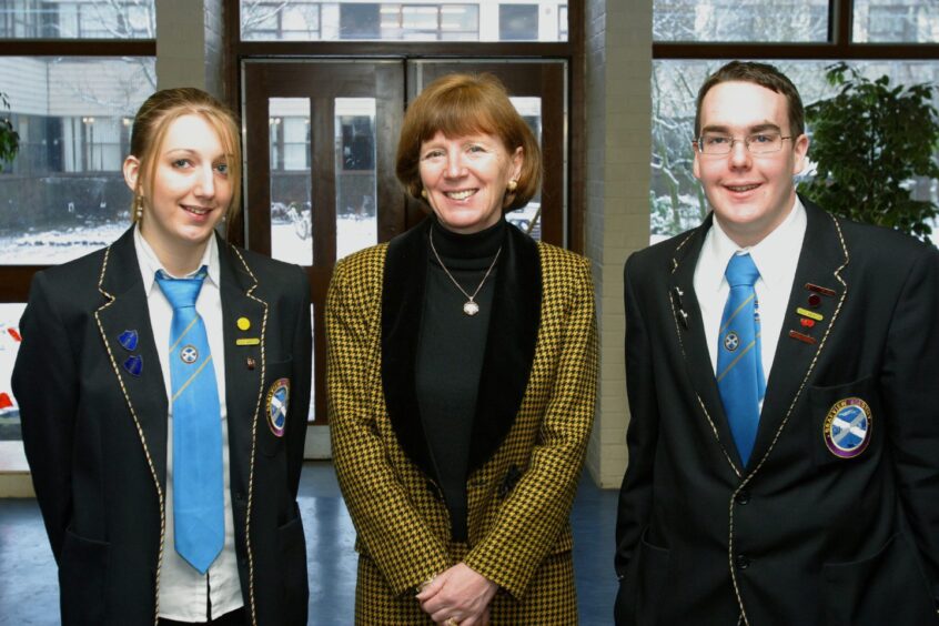 Brenda Hadcroft pictured with school captains Laura Connelly and Gregor Murray.