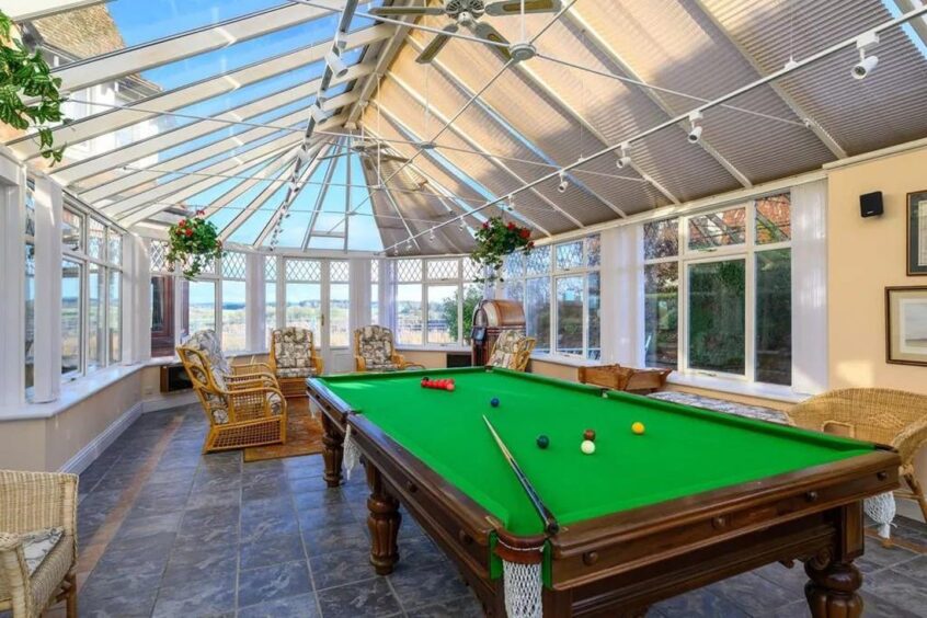 The conservatory with a snooker table
